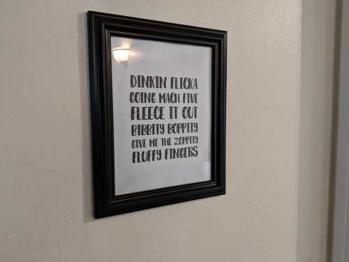 Framed wall art with playful text: "Dinkin Flicka, Going Mach Five, Fleece It Out, Ribbitty Boppity, Give Me the Zoppity, Fluffy Fingers."