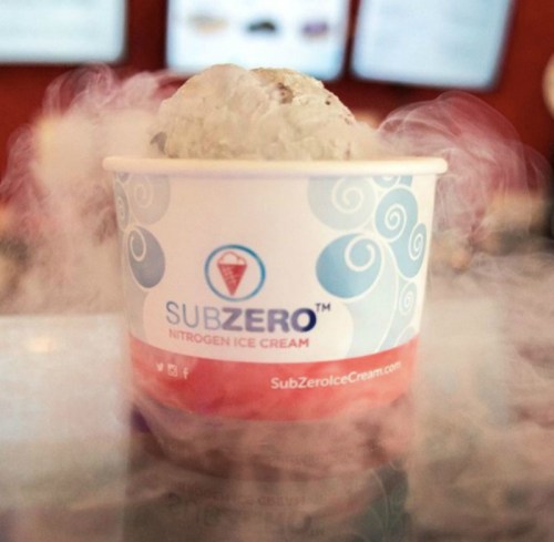 A cup of SubZero nitrogen ice cream with swirling vapor around it, showcasing a unique dessert experience.