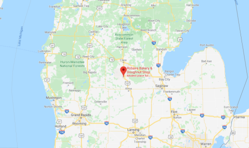 Map showing the location of Robaire Bakery & Doughnut Shop in Michigan, near Clare and surrounded by forests.