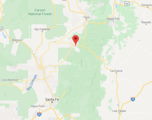 Map showing a location marked with a red pin near Taos, New Mexico, surrounded by green areas and highways.