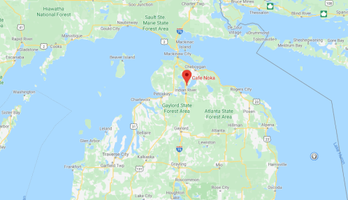 Map showing the location of Cafe Noka in Indian River, Michigan, near nearby forests and lakes.