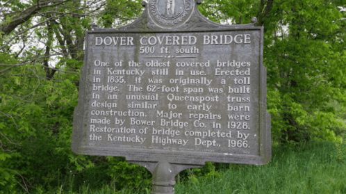 Historical marker for Dover Covered Bridge, detailing its construction in 1835 and restoration in 1966.