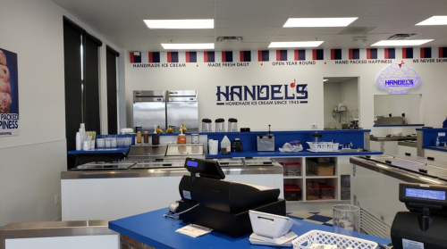 Interior of Handel's Ice Cream shop featuring a service counter, ice cream display, and a bright, clean design.