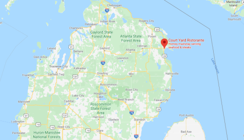 Map of northern Michigan highlighting the location of Court Yard Ristorante, known for seafood and steak.
