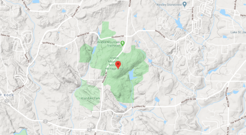 Map showing the Arab Mountain Heritage Area, marked in green, with nearby roads and parks indicated.