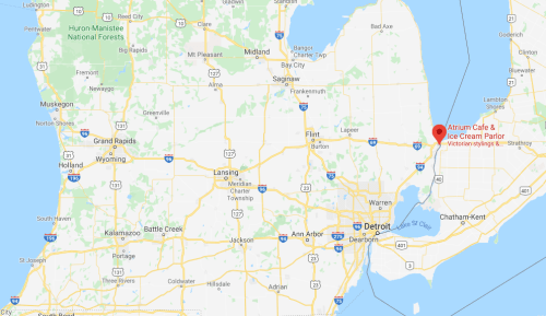 Map showing Michigan with a marker for Atrium Café & Ice Cream Parlor, near the coast and major highways.