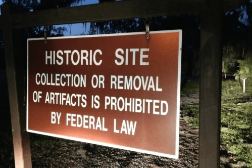 Sign at a historic site stating that collection or removal of artifacts is prohibited by federal law.