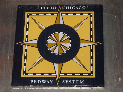 Logo of the City of Chicago Pedway System featuring a compass design in black, yellow, and gray colors.
