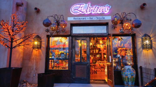 Colorful entrance of Elvira's restaurant, featuring vibrant decorations and warm lighting.