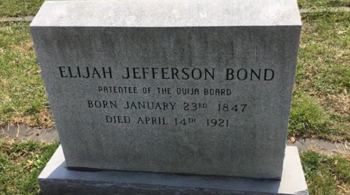 Gravestone of Elijah Jefferson Bond, inventor of the Ouija board, with birth and death dates inscribed.