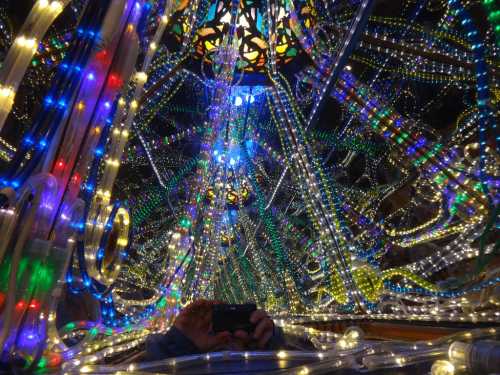 A vibrant display of colorful lights and intricate patterns, creating a mesmerizing, festive atmosphere.