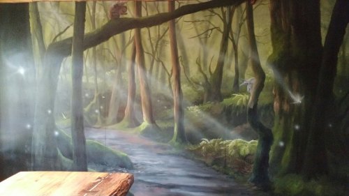 A serene forest mural depicting a misty path through tall trees, with soft light filtering through the foliage.