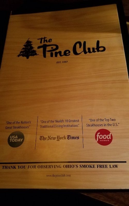 Menu cover for The Pine Club, featuring accolades from USA Today, The New York Times, and Food Network. Smoke-free notice included.