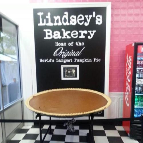 A large pumpkin pie on display at Lindsey's Bakery, known for the world's largest pumpkin pie.
