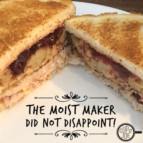 A close-up of a toasted sandwich filled with turkey, cranberry sauce, and stuffing, with a caption about its deliciousness.
