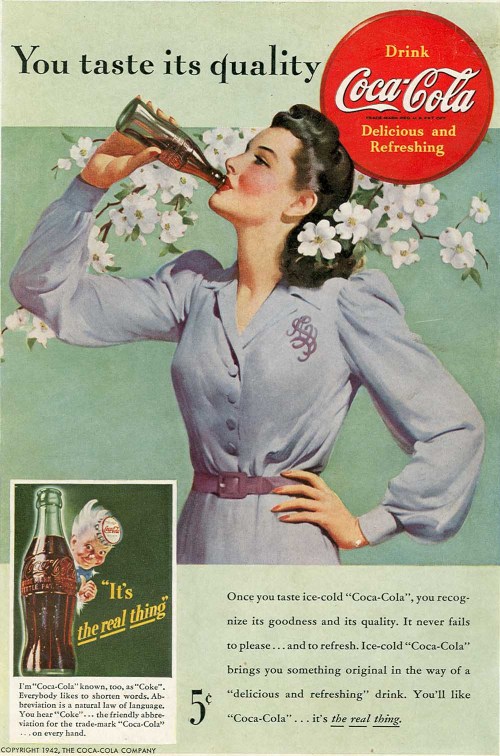 Vintage Coca-Cola advertisement featuring a woman in a blue dress holding a bottle, surrounded by flowers.