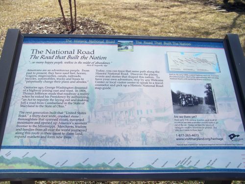 Sign about the National Road, highlighting its historical significance and impact on travel and settlement in the U.S.
