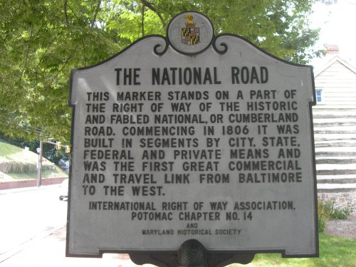 Historical marker for the National Road, detailing its significance and construction history from 1806.