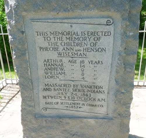 Memorial stone honoring the Wiseman children, detailing their ages and the date of their massacre in 1863.