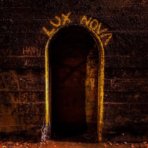 An arched doorway in a dark, textured wall, with the words "LUX NOVA" painted above it.