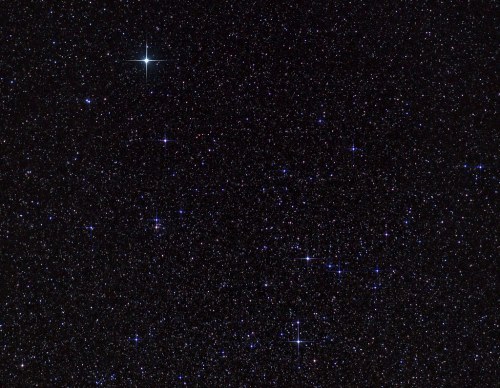A starry night sky filled with numerous bright stars against a dark background.