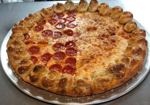 A large pizza divided into two halves: one with pepperoni and the other with cheese, featuring a stuffed crust.
