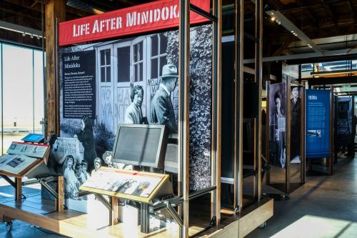 Exhibit titled "Life After Minidoko" featuring historical displays and photographs in a museum setting.