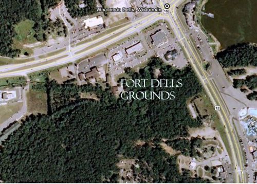 Aerial view of Fort Dells Grounds in Wisconsin Dells, surrounded by roads and wooded areas.