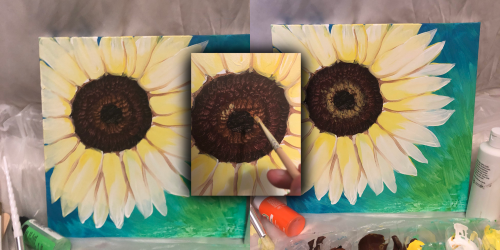A close-up of a sunflower painting, with a hand holding a brush, surrounded by art supplies and two canvas versions.