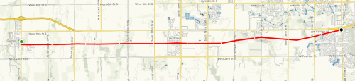 Map showing a red line route from Godfrey to an intersection, with surrounding streets and landmarks.