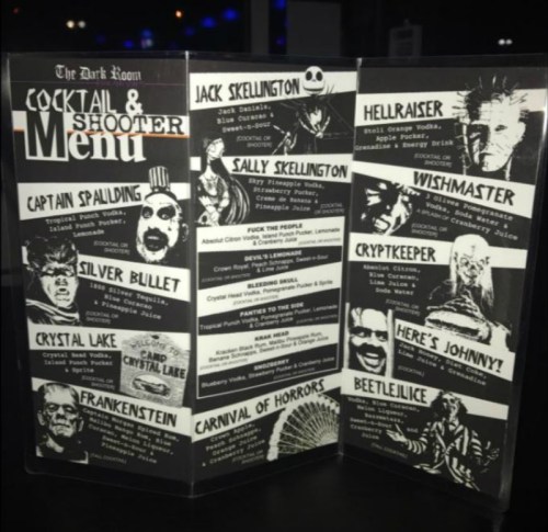 A cocktail and shooter menu featuring themed drinks with horror-inspired names and illustrations.