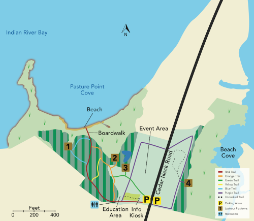 Map of a park featuring trails, a beach, event area, parking, and restrooms near Indian River Bay.