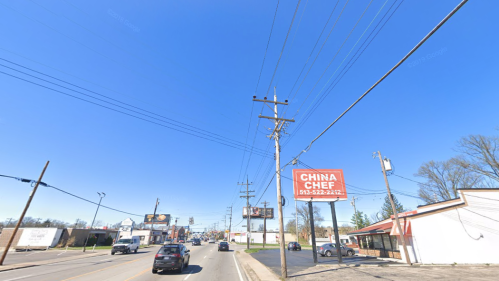 A street view featuring a "China Chef" restaurant sign, power lines, and clear blue sky.