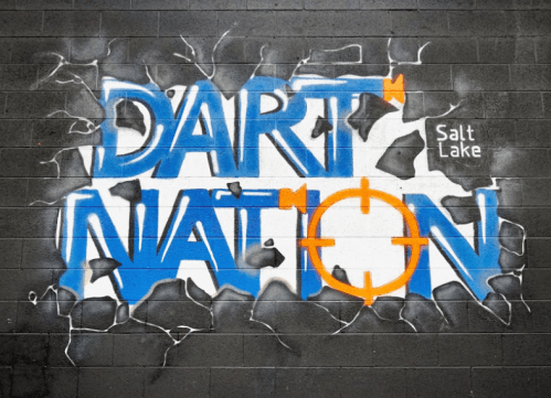 Colorful graffiti on a wall reads "DART NATION" with a target symbol, located in Salt Lake.