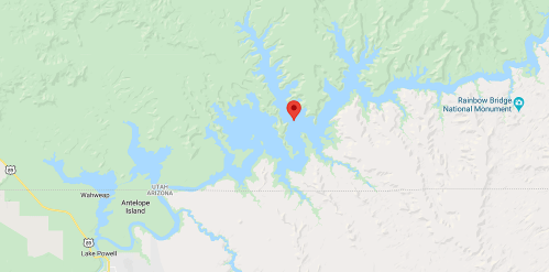 Map showing a body of water with a red marker indicating a location near Antelope Island and Rainbow Bridge National Monument.