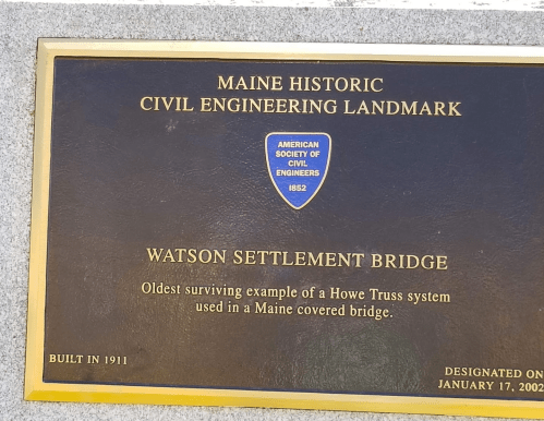 Plaque detailing the Watson Settlement Bridge as a Maine Historic Civil Engineering Landmark, built in 1911.