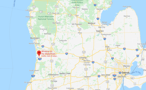 Map showing the location of "Window on the Waterfront" near the coast of Michigan, with nearby cities and landmarks.