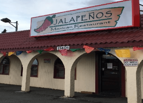 Exterior of Jalapeños Mexican Restaurant, featuring a colorful sign and festive decorations.