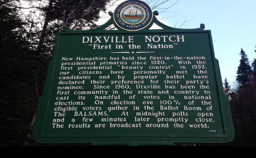 Sign about Dixville Notch, New Hampshire, highlighting its role in the first presidential primaries since 1920.