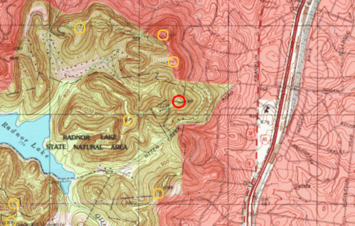Topographic map showing Radnor Lake State Natural Area with contour lines, roads, and marked points of interest.