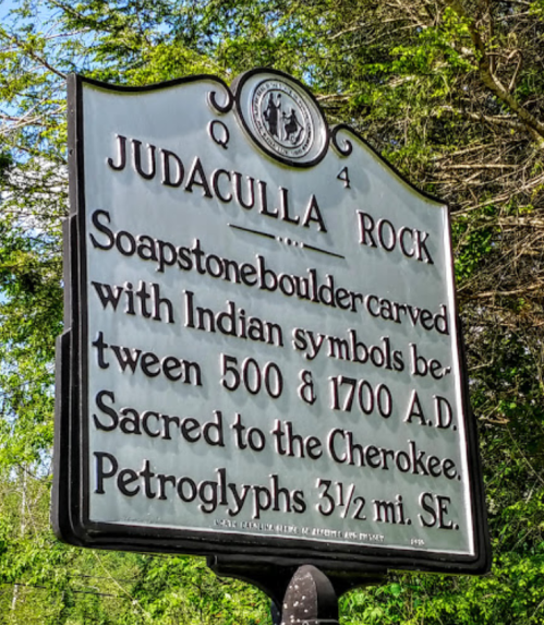 Sign for Judaculla Rock, detailing its history and significance with Indian symbols carved between 500 and 1700 A.D.