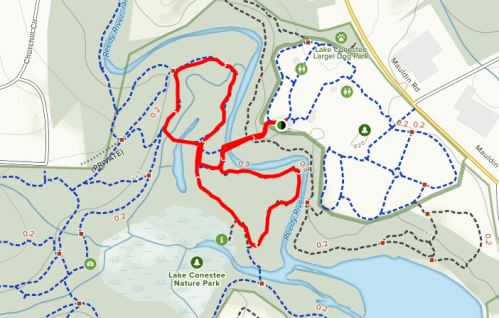 Map showing a trail marked in red around Lake Conestee, with nearby parks and paths indicated in blue and dotted lines.