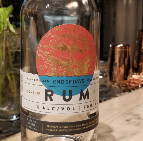 A bottle of "End of Days" rum with a ship illustration, labeled with 750 ml and 40% alcohol content.