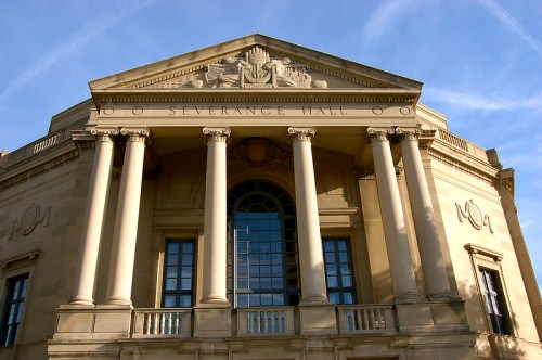 Front view of Severance Hall, featuring classical architecture with tall columns and a decorative pediment.