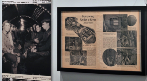 Black and white photo of miners in a tunnel, alongside a framed newspaper article about tunneling under a river.