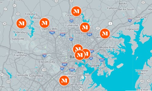 Map of Baltimore with multiple orange markers indicating specific locations.