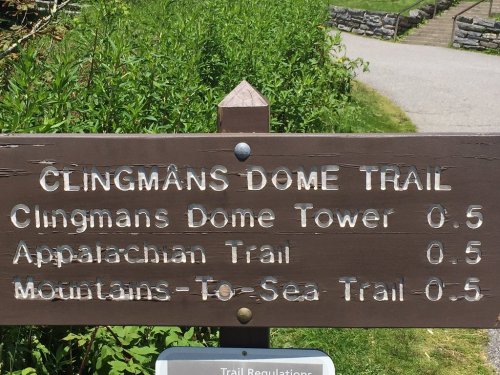 Signpost for Clingmans Dome Trail, indicating distances to Clingmans Dome Tower, Appalachian Trail, and Mountains-To-Sea Trail.