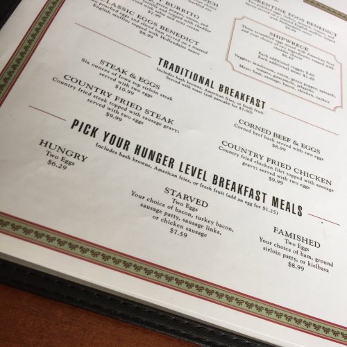 Menu featuring breakfast options like burritos, eggs benedict, and various hunger level meals with prices listed.