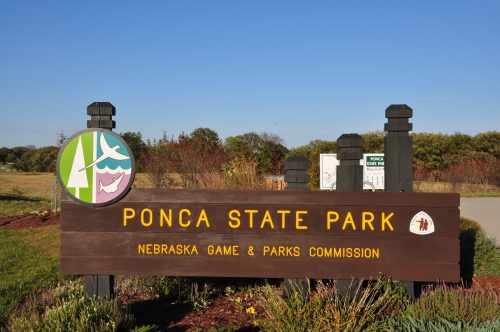 Sign for Ponca State Park, featuring the park's logo and information from the Nebraska Game & Parks Commission.