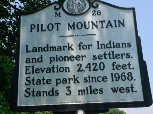 Sign for Pilot Mountain, noting its elevation of 2,420 feet and history as a landmark for settlers and Native Americans.